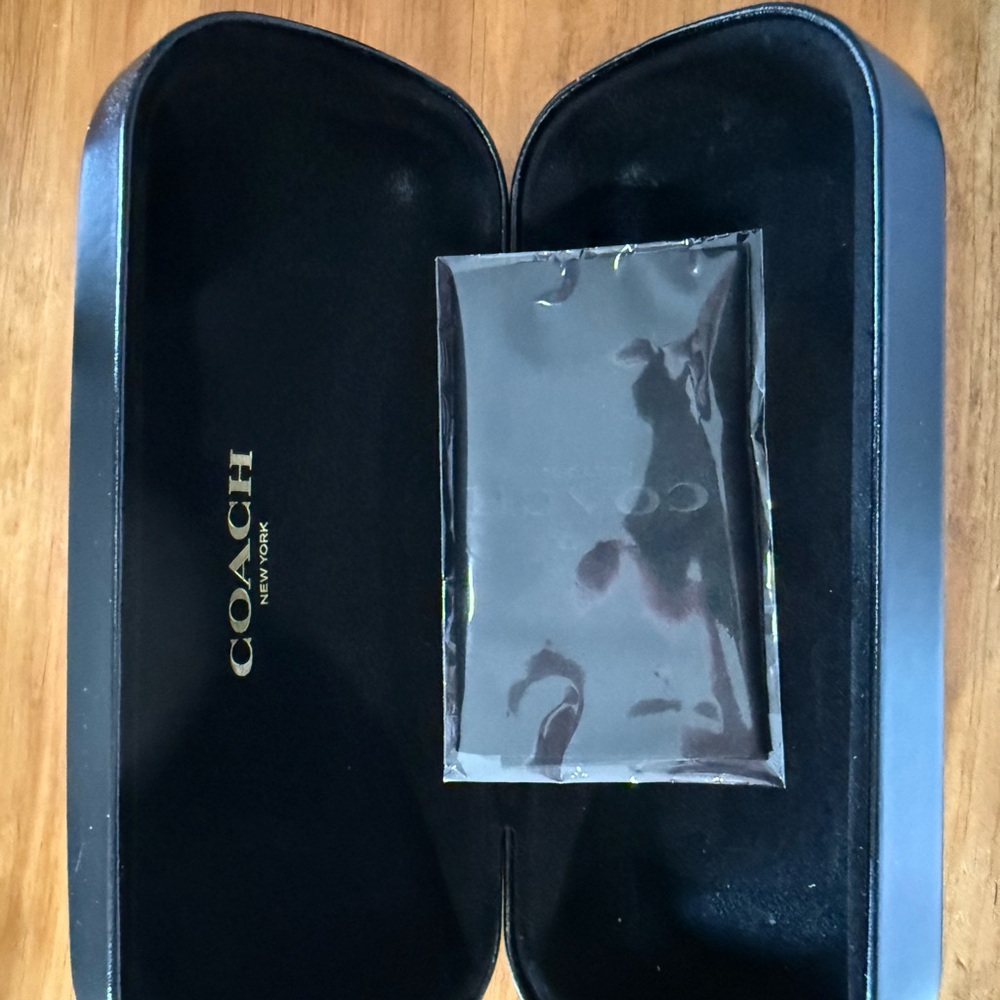 Coach eye glass case with cloth wipe